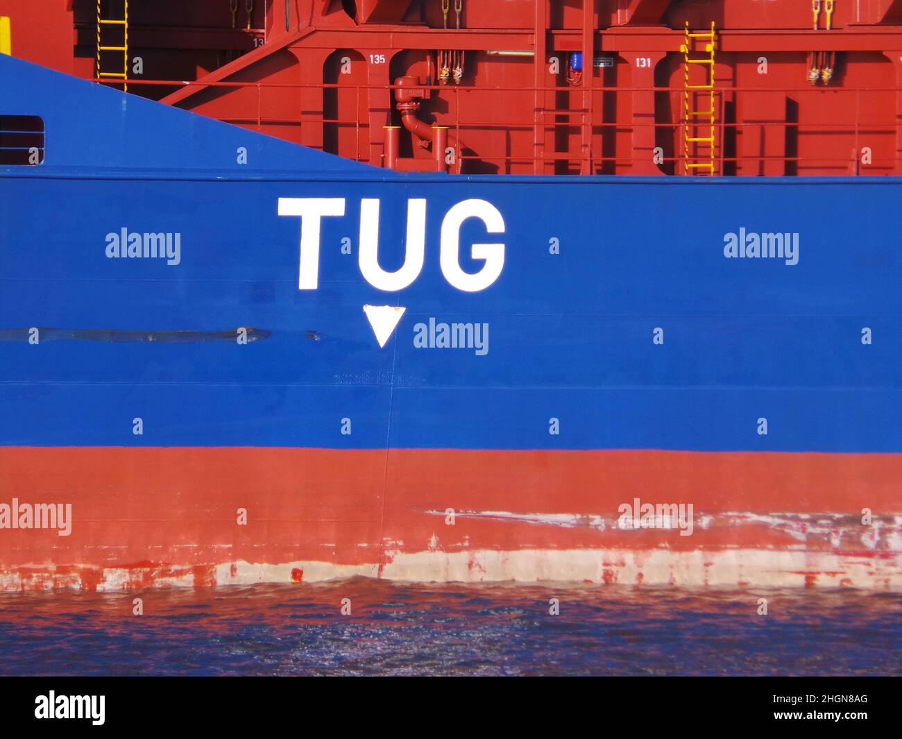 tug-marker-sign-on-freight-ship-2HGN8AG.jpg